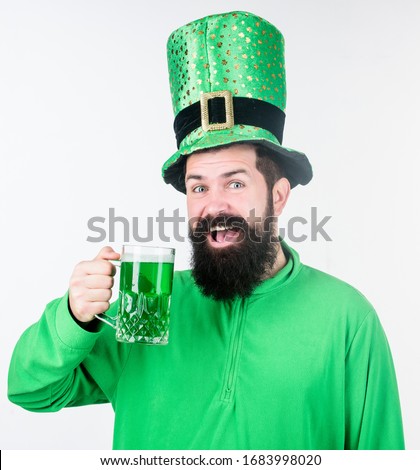 Cheers concept. Colored patricks beverage. Green color part of celebration. Irish beer pub. Celebration irish culture. Man bearded hipster hat patricks day drink pint beer. Saint patricks day holiday.