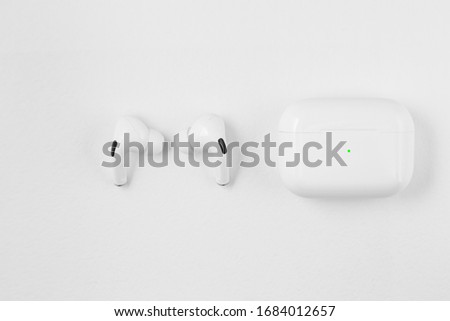 Air Pods pro. with Wireless Charging Case. New Airpods pro on white background. Airpodspro. female headphones.Copy Space.EarPods Royalty-Free Stock Photo #1684012657