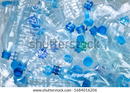 Plenty of plastic bottles on white background top view Royalty-Free Stock Photo #1684016206
