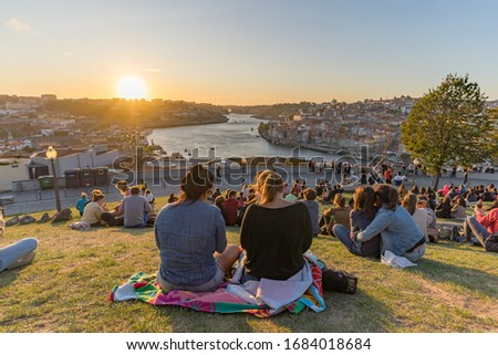 View to Porto Old Town during sunset. The riverside is full of nice restaurants to have a small break and enjoy the romantic sunset. Royalty-Free Stock Photo #1684018684