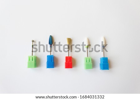 Nail Care Concept. Cutters for hardware manicure and pedicure. Accessories and manicure nail tool. Milling cutter for manicure. Royalty-Free Stock Photo #1684031332