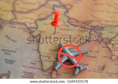Airplane with sign "forbidden" on India part of world map. Ban of flight to India due to coronavirus concept. Royalty-Free Stock Photo #1684103578