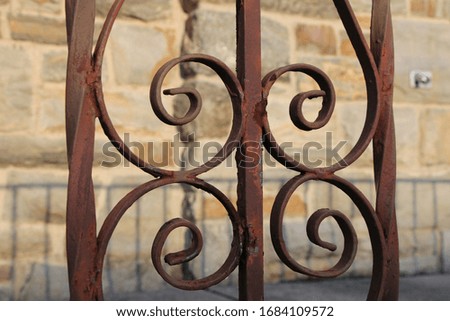 rusty ironwork with stone background