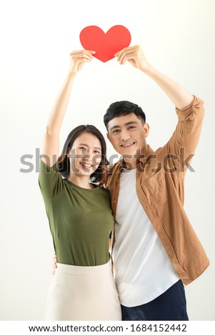 Bright picture of beautiful couple holding big heart