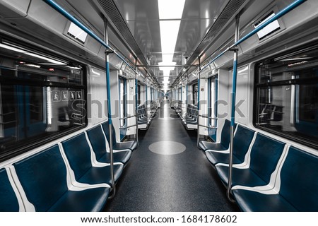Interior view of a subway. Empty subway transport. Royalty-Free Stock Photo #1684178602