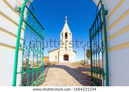 russian church ancient orthodox religion landmark in russia at day time against blue sky background Gate entrance to old outpost in Tver region Russia street landscape view of tourist attraction