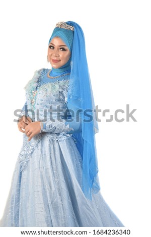 portrait of a beautiful muslim woman wearing a headscarf isolated on white background