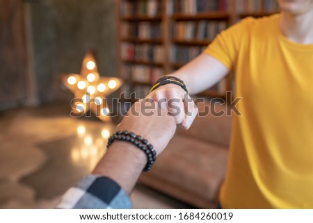 Mens hands. Close up picture of mans hands putting fist to fist