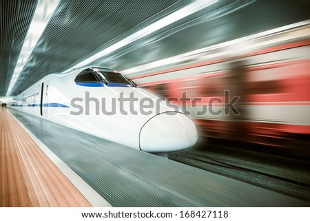 high speed train passing station with motion blur background Royalty-Free Stock Photo #168427118