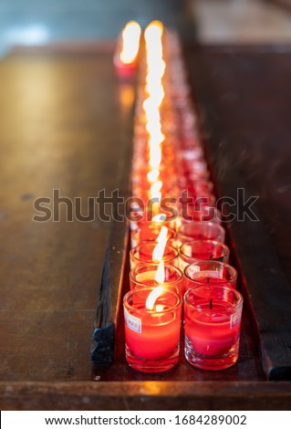 Nonthaburi Thailand - February 19, 2020 : Red candles that Buddhists bring to make merit for the monks. Within Leng Nei Yi 2 Temple, located in Nonthaburi, Thailand