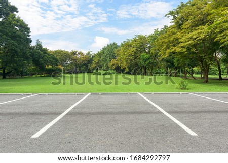 Parking lot in public park Royalty-Free Stock Photo #1684292797