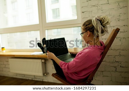 Young Woman Doing Office Work At Home