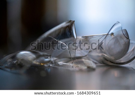blurred background without focus, a broken glass on the floor