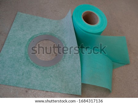 A hydro tape green roll for corner hydroisolation with a green shower pan  hydroisolation, hydrostop. Royalty-Free Stock Photo #1684317136