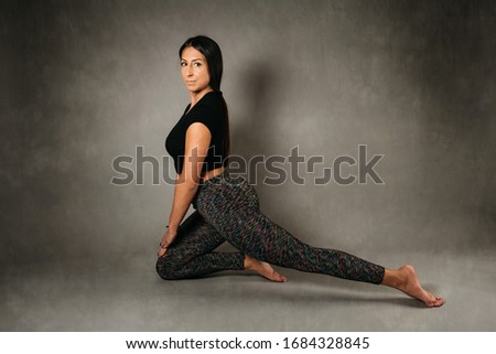 Beautiful young woman doing yoga. Relaxation and meditation concept.