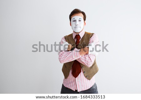Portrait of man, actor, pantomime, man making cold gesture, coughing. Emotions, facial expressions, feelings, body language, signs. Image on white studio background