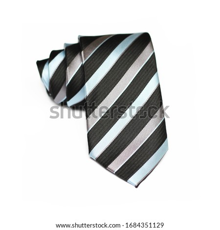 Silk Tie Isolated on white background, rolled tie close up