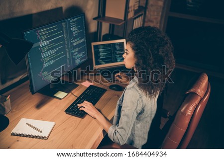 Top above high angle view photo of concentrated afro american girl sit evening table desk work server framework website maintenance operating system html document use pc in workstation