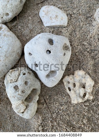 Man face rocks on beach Royalty-Free Stock Photo #1684408849