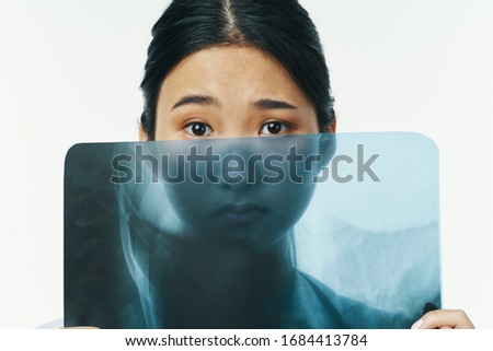 Woman narrow eyes doctor x-ray