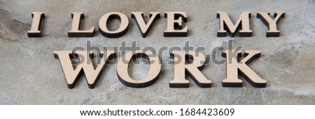 I love my work , writen wooden letters on stone background. I love my work  concep image.
