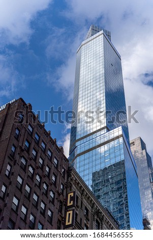 Reflections of the clouds on a glass skyscraper in new york city