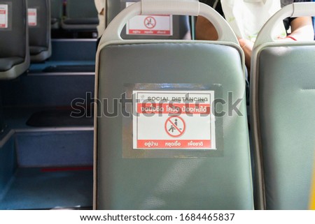 Seat on public buses with signs social distancing protect for pandemic of disease virus Covid-19 in Thailand,Thai language translation No sitting, Covid, Protect,Stay at home,Stop 
 infection,national