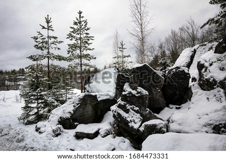 Scenic landscape of marble stones covered by snow, Ruskeala, Karelia, Russia