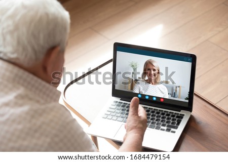 Screen view happy pretty middle aged woman talking speaking chatting with older father husband, enjoying pleasant conversation online via computer video call, e-dating distant communication concept. Royalty-Free Stock Photo #1684479154