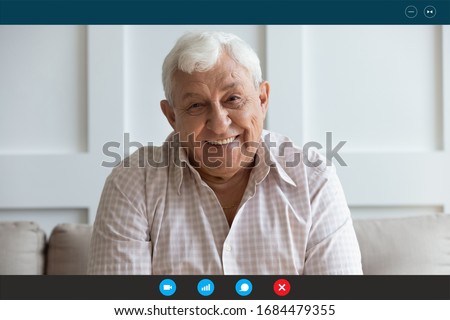 Head shot screen software application view happy middle aged elderly man communicating chatting talking speaking with grown up children family or friends online, staying at home during quarantine. Royalty-Free Stock Photo #1684479355