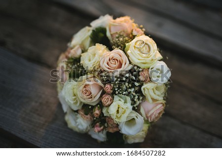 wedding rings on wedding 
bouquet