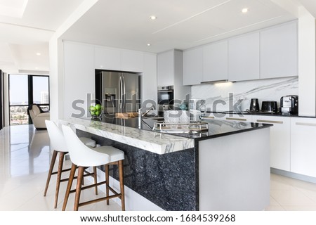 White and grey modern kitchen  Royalty-Free Stock Photo #1684539268