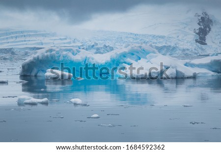 Antarctic landscape with glaciers, icebergs, mountains