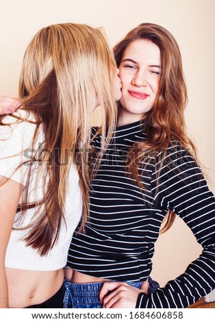 best friends teenage girls together having fun, posing emotional on white background, besties happy smiling, lifestyle people concept closeup. making selfie