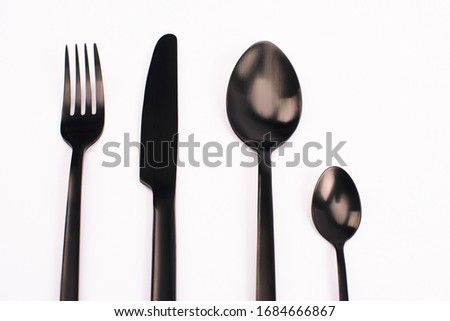 top view of knife, fork and spoons isolated on white
