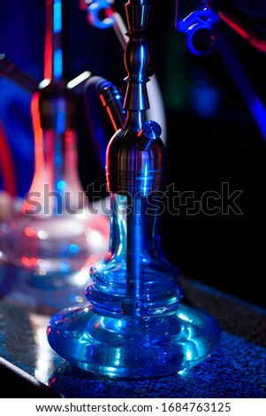 Multicolored hookah in the restaurant. Hookah elements on the background of a interior of the restaurant, a cafe.