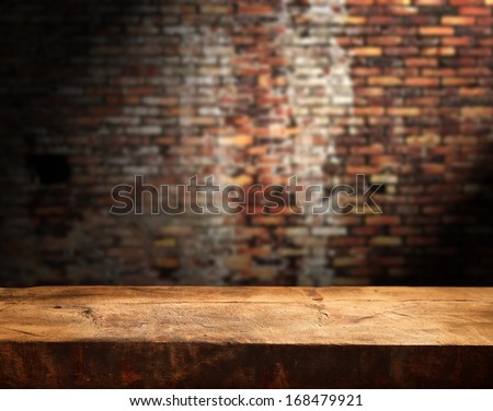 Empty table and brick wall in background. Great for product display.