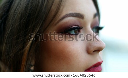 
Young woman face opening eyes
