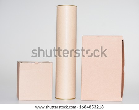 Cardboard boxes and tube brown on white grey background