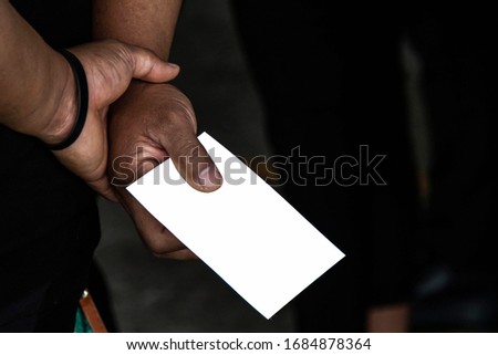A man with a hand at a postcard with clipping path postcard