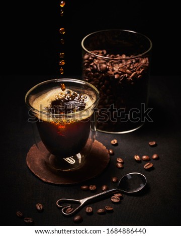 Coffee on a black background shot from above                 