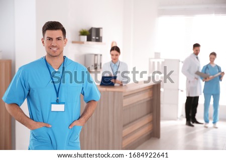 Portrait of male doctor in modern clinic
