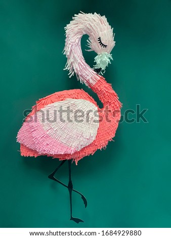 pink flamingo pinyatta green background