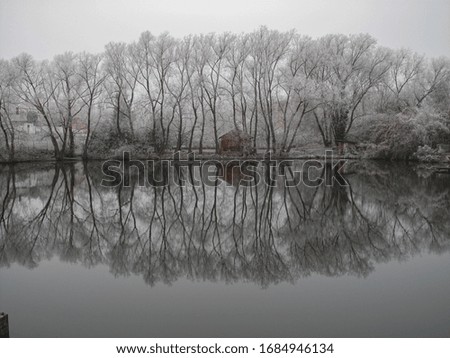 
BEAUTIFUL PICTURES OF FROZEN LAKE AND REFLECTION ON IT CZECH REPUBLIC