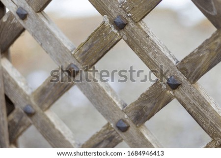 wooden gate with metal fastenings and metal ancient locks