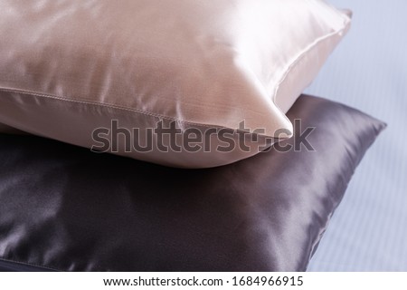
pillows in silk pillowcases closeup Royalty-Free Stock Photo #1684966915