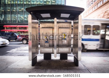 Pay phone on New York City urban street corner Royalty-Free Stock Photo #168501551