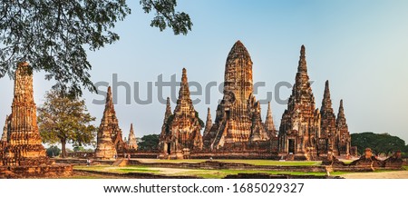 Tourists visit ancient Wat Chai Watthana Ram Temple in old historic district of Ayutthaya, Thailand