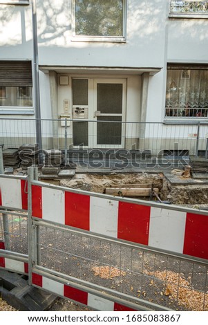 repairing pipeline at the city street. Construction site on a damaged drinking water supply line. Closed to traffic. Underground communications repair, pipeline replacement in Krefeld, Germany.