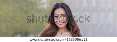 Beautiful smiling friendly young woman